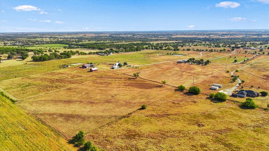 Tbd Cashs Mill Road Sanger, TX 76266 - Photo 8 of 21 Expansive property featuring varied terrain, a winding private driveway, and multiple outbuildings