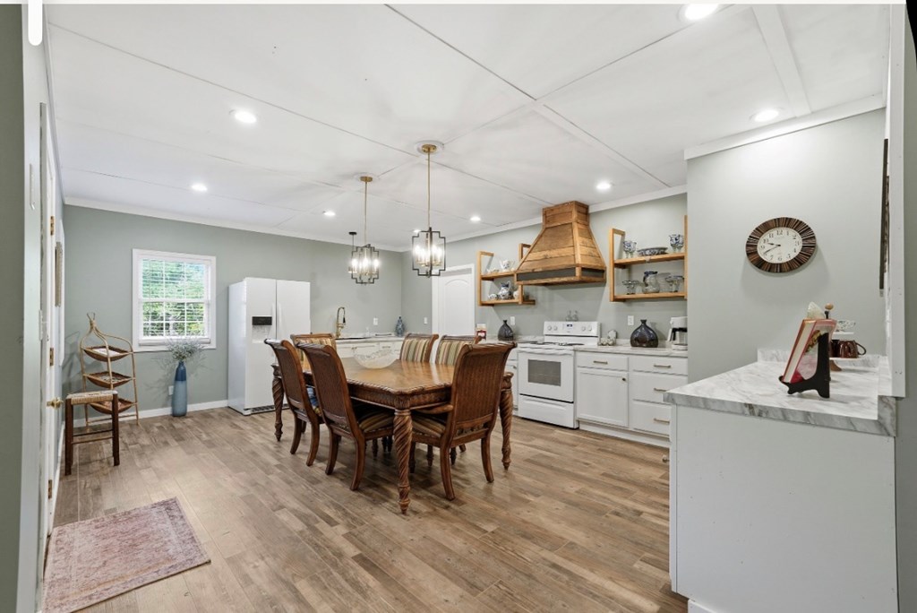 178 Windy Valley Lane Blue Ridge, GA 30513 - Photo 25 of 37 a kitchen with a dining table chairs and refrigerator