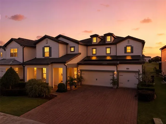 a view of a house with a small yard and plants