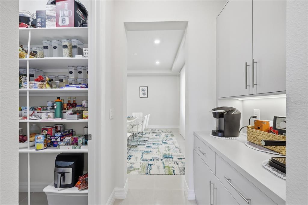 7537 Wandering Way Orlando, FL 32836 - Photo 15 of 71 a kitchen with a refrigerator and cabinets