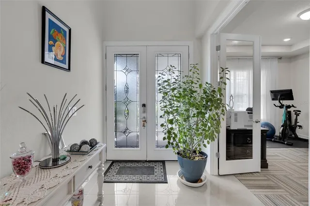 a living room with furniture and potted plant
