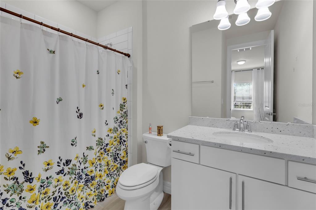 7537 Wandering Way Orlando, FL 32836 - Photo 42 of 71 a bathroom with a sink vanity mirror and toilet