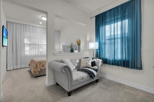 an aerial view of residential houses with outdoor space and river