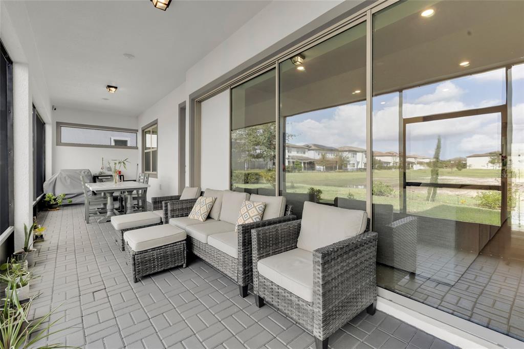 7537 Wandering Way Orlando, FL 32836 - Photo 49 of 71 a living room with furniture and large windows