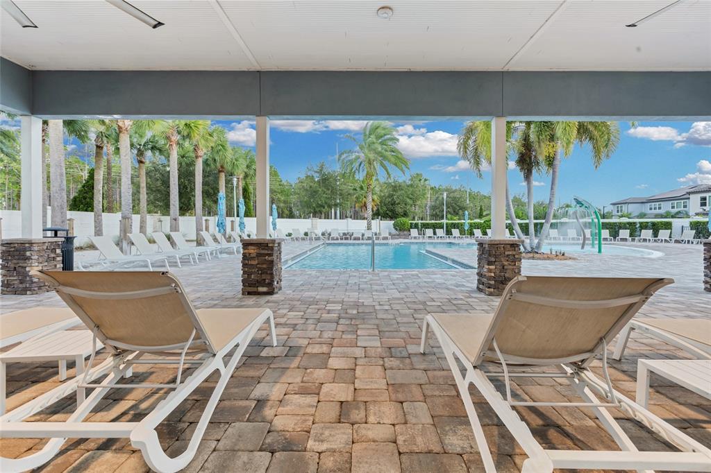 7537 Wandering Way Orlando, FL 32836 - Photo 55 of 71 a living room with patio furniture and a floor to ceiling window