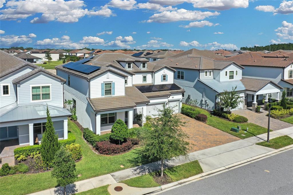 7537 Wandering Way Orlando, FL 32836 - Photo 56 of 71 a front view of a residential apartment building with a yard