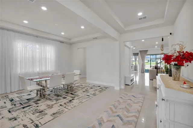 a kitchen with stainless steel appliances white cabinets and a sink