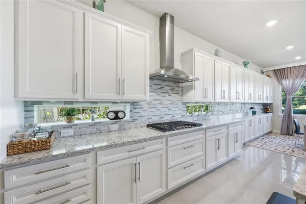 a kitchen with a refrigerator and cabinets
