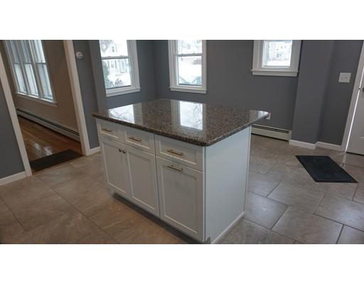 39 Neptune Avenue West Springfield, MA 01089 - Photo 4 of 28 a open kitchen with windows and refrigerator