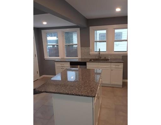 39 Neptune Avenue West Springfield, MA 01089 - Photo 5 of 28 a bathroom with a granite countertop sink and a mirror