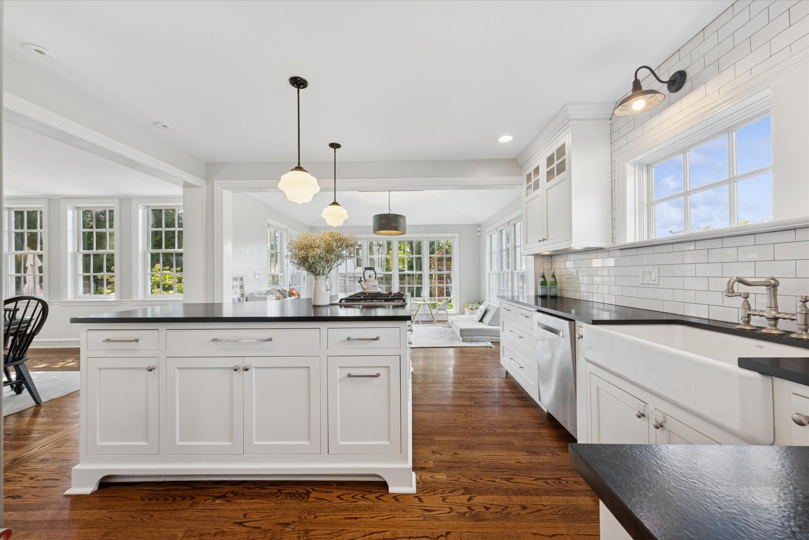 418 West Franklin Street Wheaton, IL 60187 - Photo 13 of 35 a large kitchen with granite countertop a stove a sink a window and white cabinets