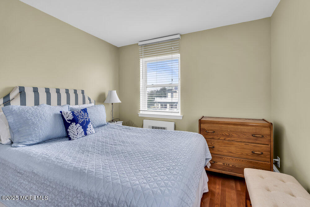 317 8th Avenue, Unit 303 Asbury Park, NJ 07712 - Photo 12 of 15 a bedroom with a bed and window