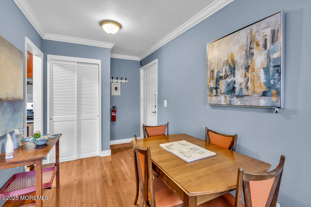 317 8th Avenue, Unit 303 Asbury Park, NJ 07712 - Photo 2 of 15 a dining room with a table and chairs