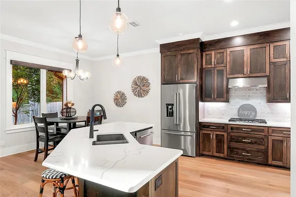 a bedroom with a bed window and a flat screen tv