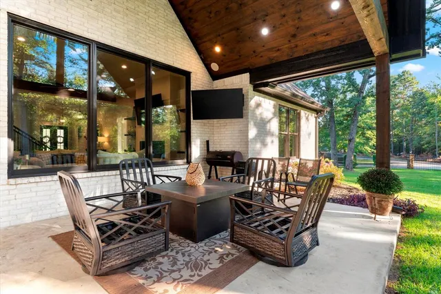 a outdoor space with patio the couches and a dining table with garden view