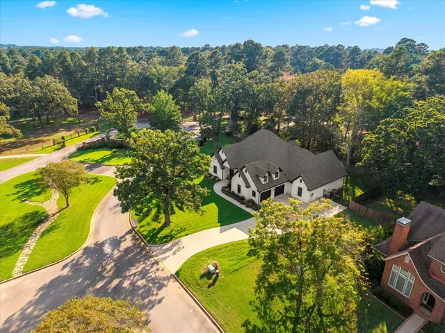 a view of a swimming pool with a yard