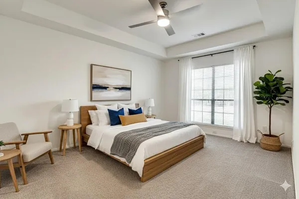 a bedroom with a bed couch and window