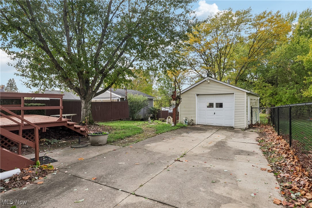 1674 Betz Road Akron, OH 44306 - Photo 3 of 29 Detached garage with concrete driveway and deck