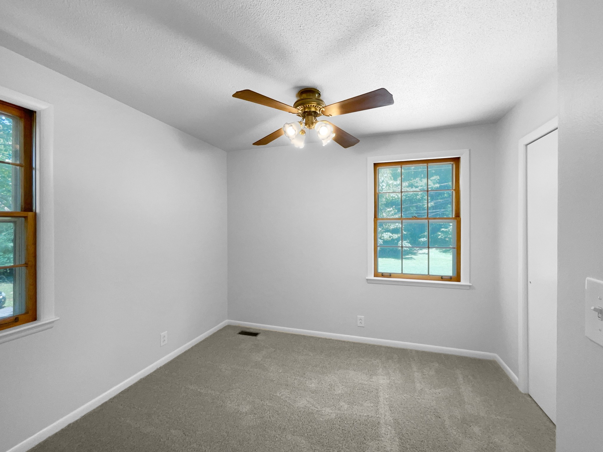 2005 Post Road Clarksville, TN 37043 - Photo 5 of 20 an empty room with windows and fan