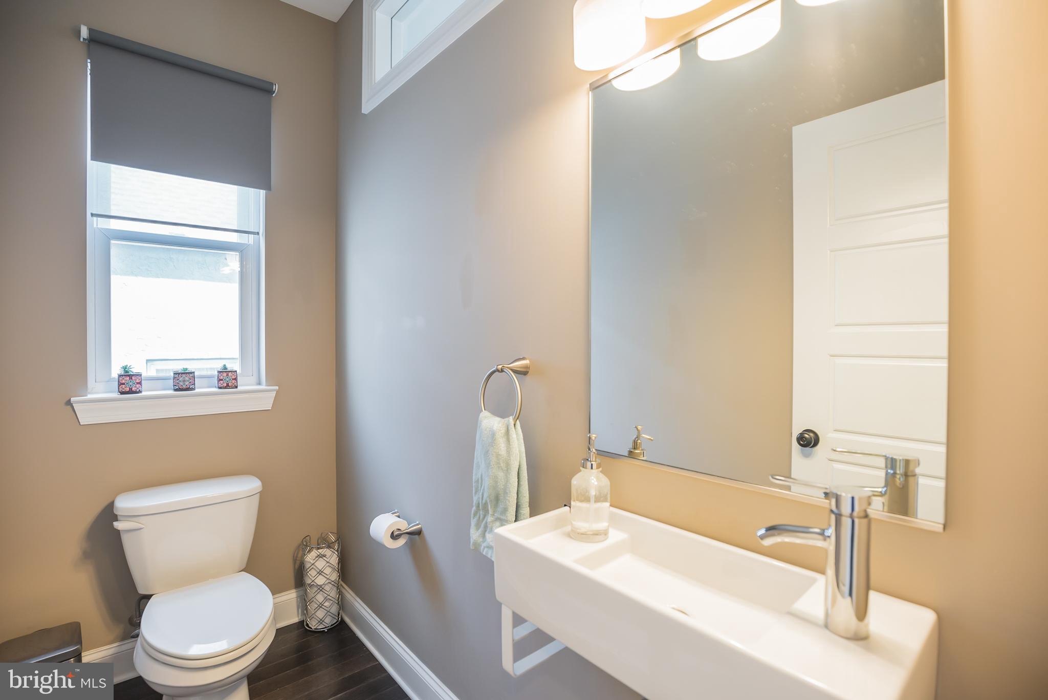534 Green Lane Philadelphia, PA 19128 - Photo 2 of 43 a bathroom with a sink a toilet and a mirror