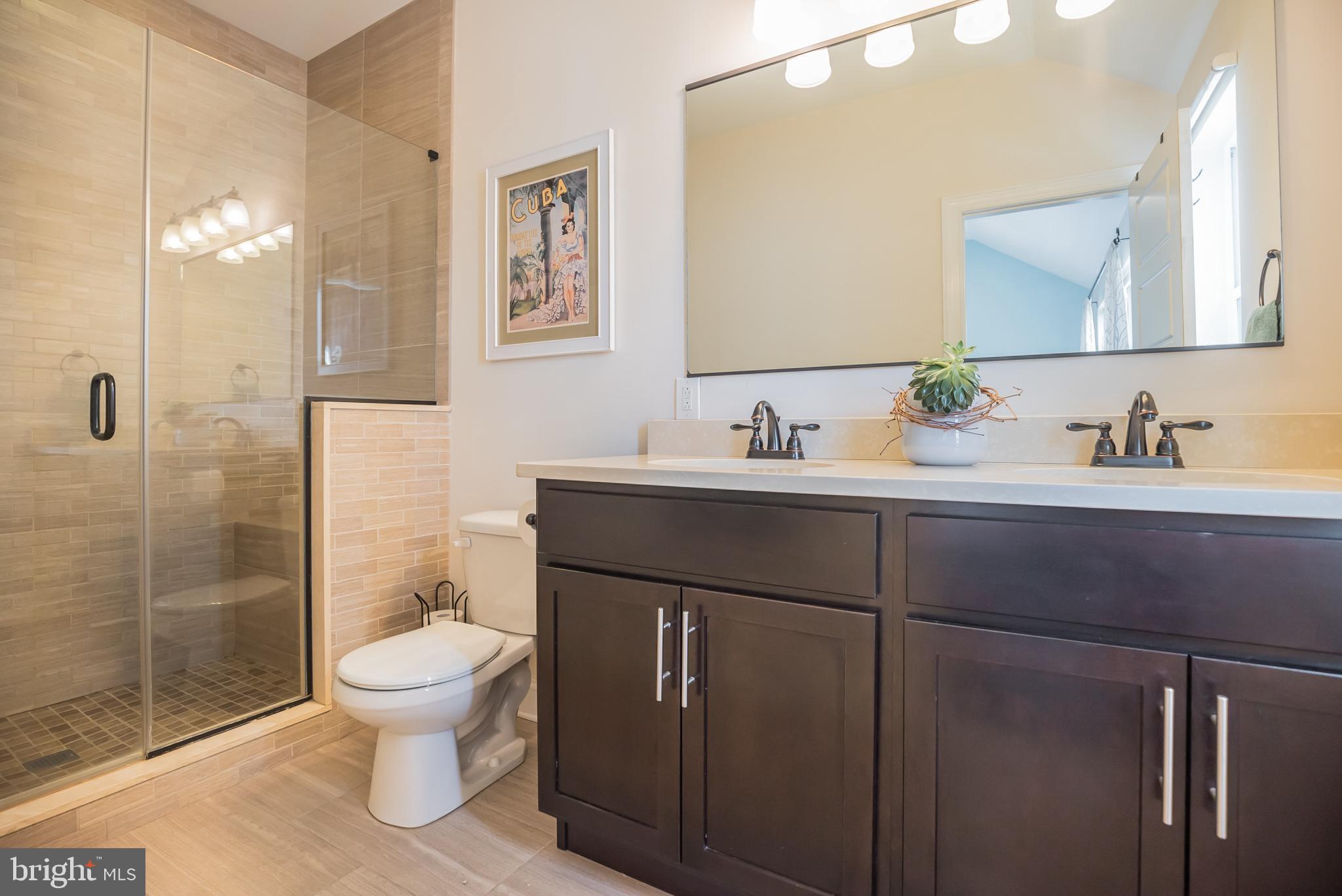 534 Green Lane Philadelphia, PA 19128 - Photo 27 of 43 a bathroom with a toilet sink and mirror