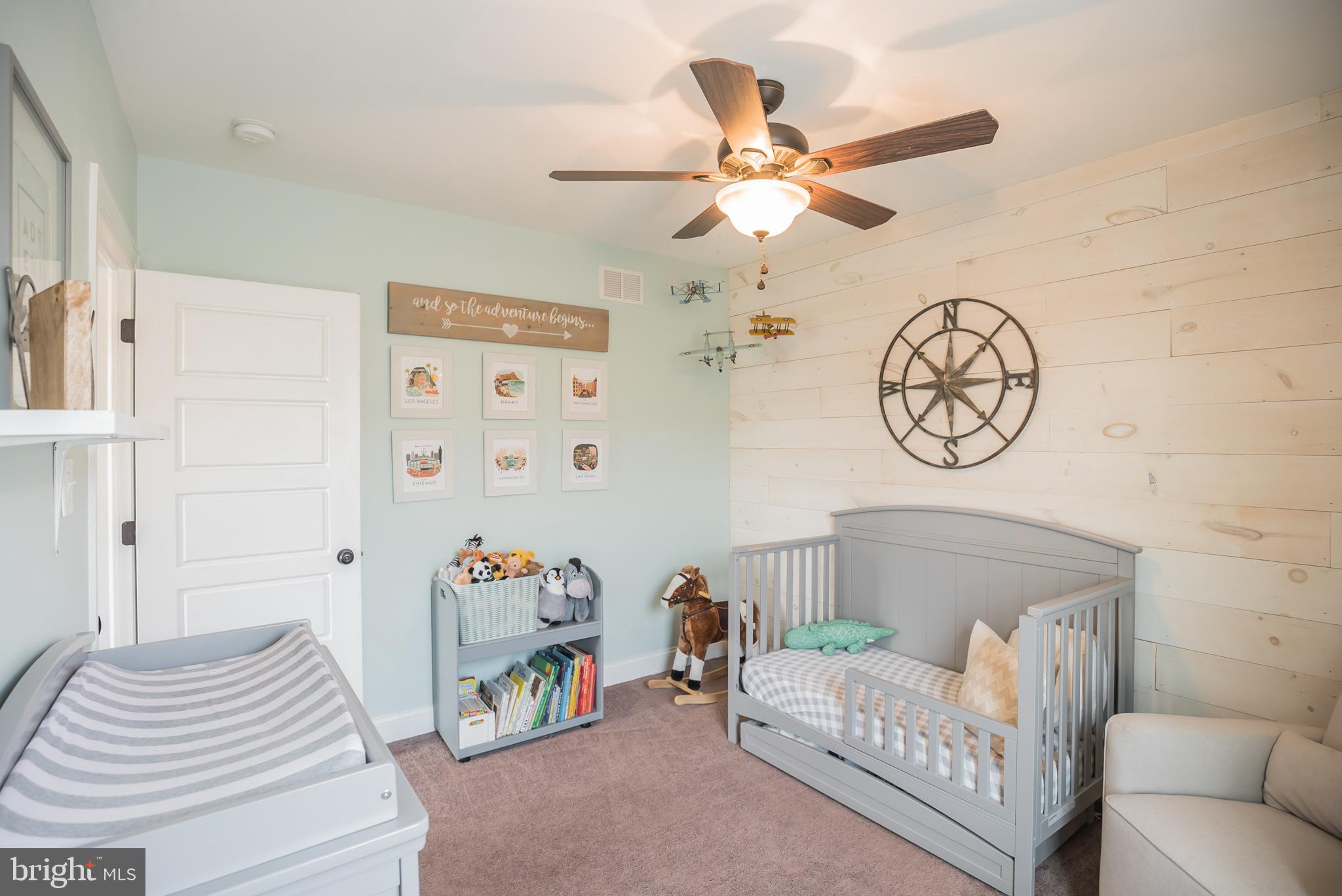 534 Green Lane Philadelphia, PA 19128 - Photo 32 of 43 a living room with furniture and a baby crib