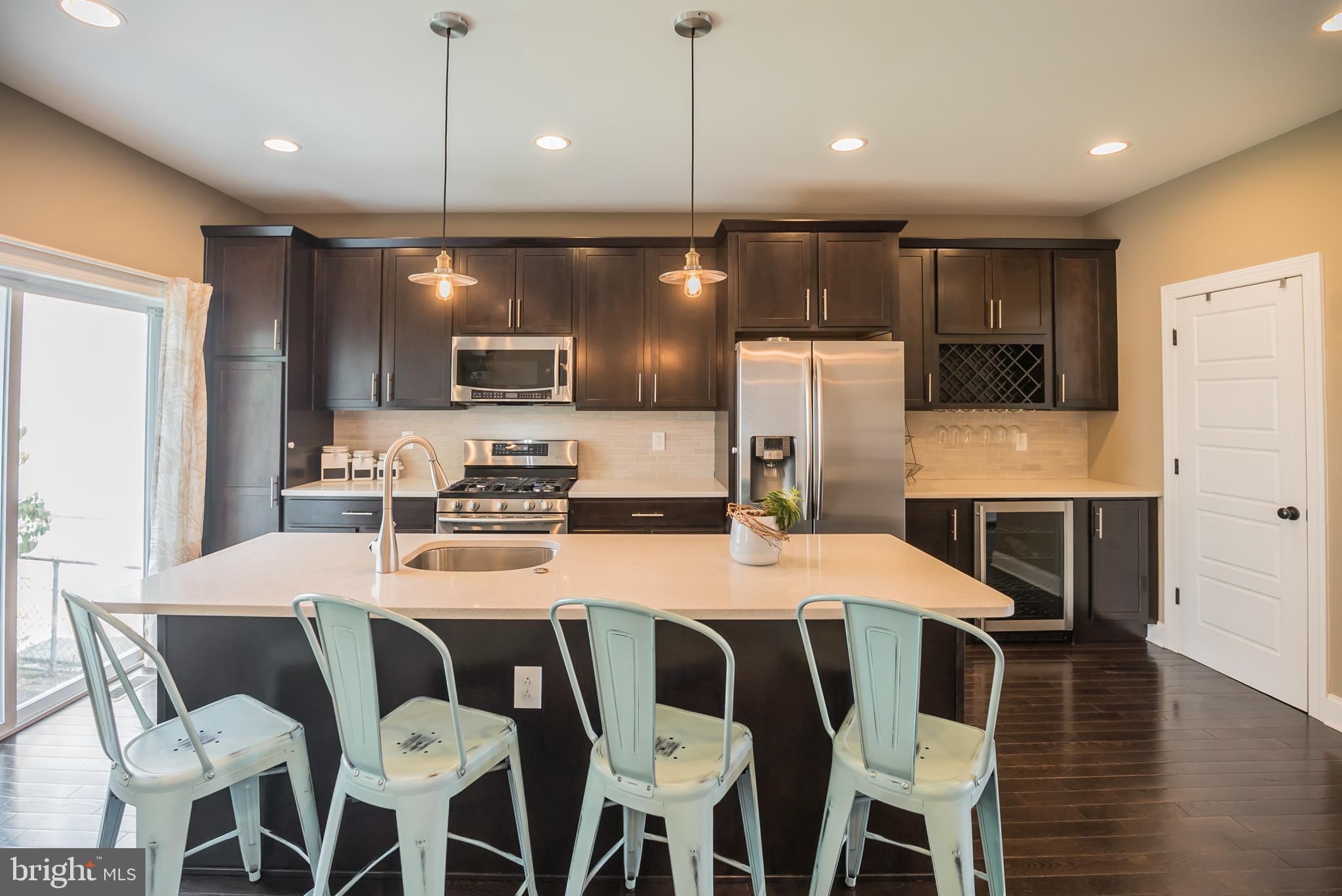 534 Green Lane Philadelphia, PA 19128 - Photo 8 of 43 a large kitchen with a table and chairs