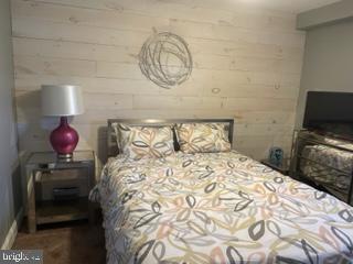 534 Green Lane Philadelphia, PA 19128 - Photo 10 of 43 a bedroom with a bed and a chandelier