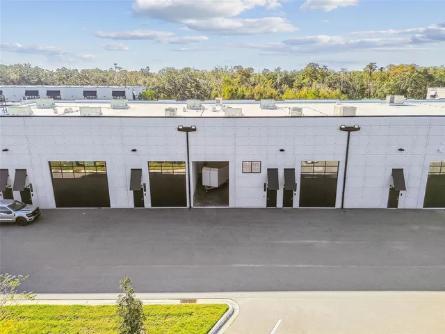 a view of a swimming pool with lounge chairs