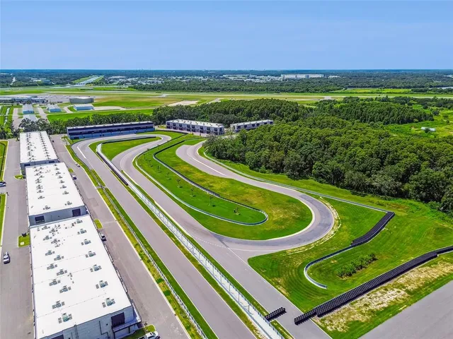 a view of a swimming pool with lounge chairs