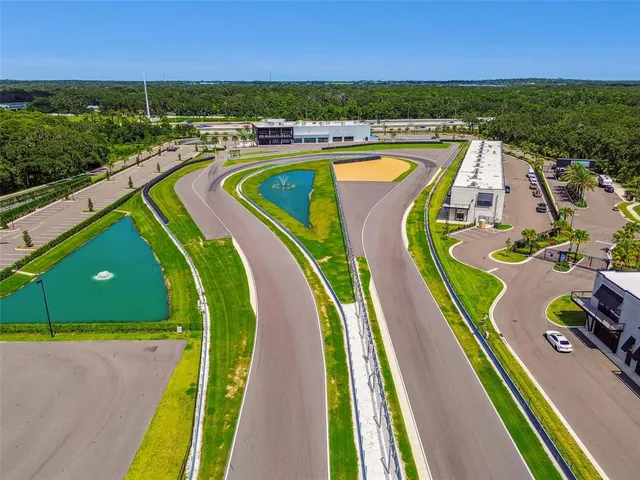 a view of swimming pool with a patio and a yard