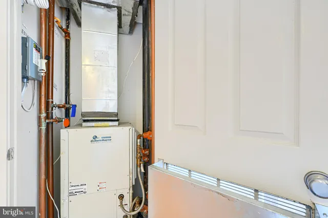 a view of a storage & utility room with a window