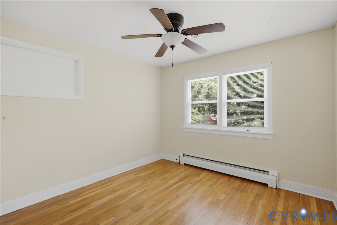 8210 Ireton Road Henrico, VA 23228 - Photo 22 of 36 wooden floor in an empty room with a window