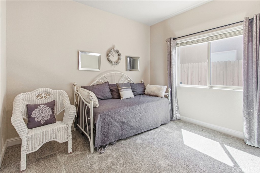 3716 Magellan Drive Merced, CA 95340 - Photo 13 of 27 a bedroom with a bed and chair