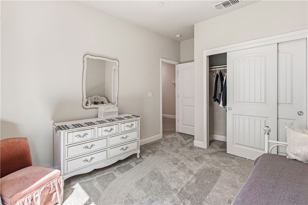 3716 Magellan Drive Merced, CA 95340 - Photo 14 of 27 a view of a bedroom with closet and cabinet