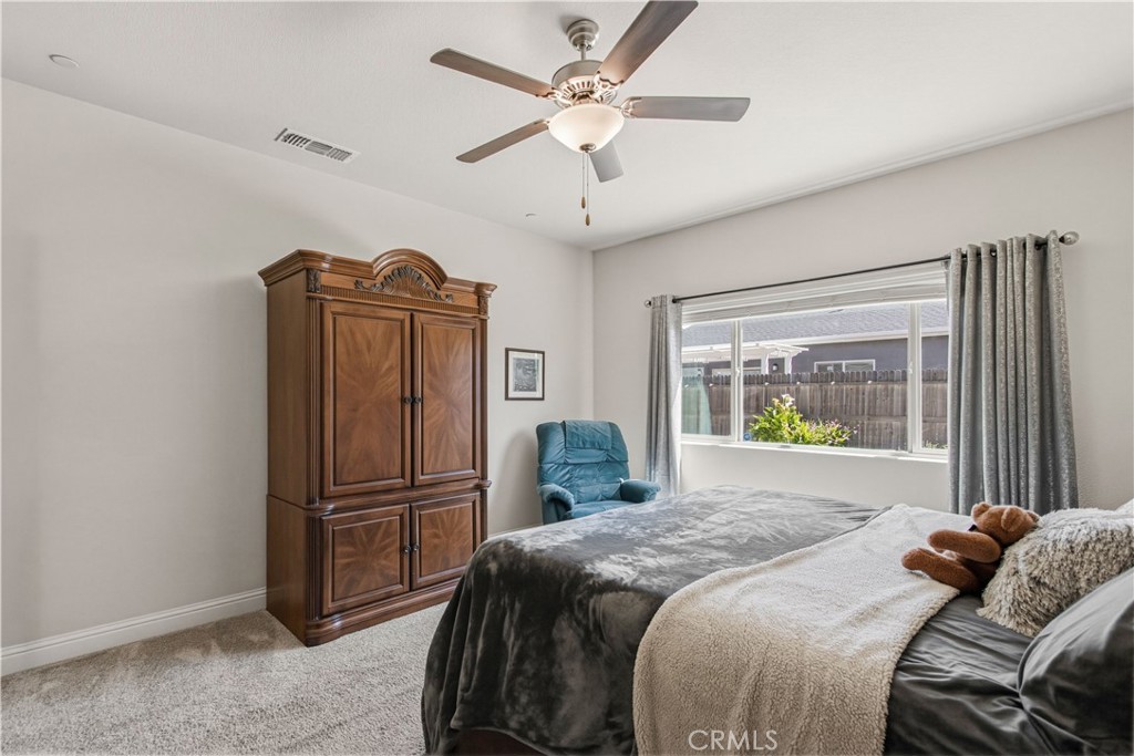 3716 Magellan Drive Merced, CA 95340 - Photo 17 of 27 a bedroom with a bed and a window