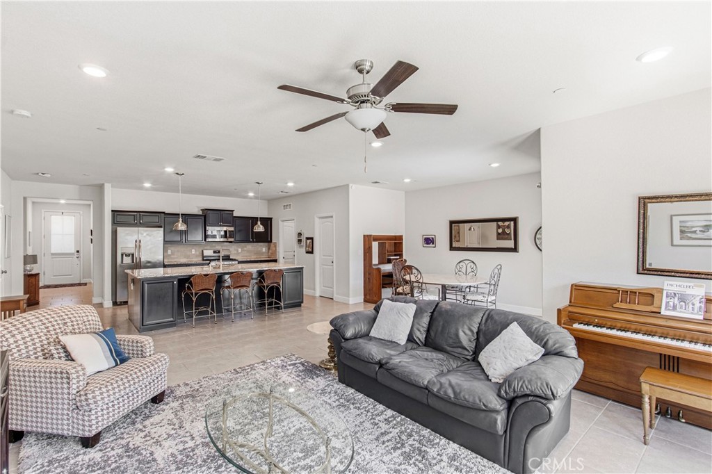 3716 Magellan Drive Merced, CA 95340 - Photo 7 of 27 a living room with furniture kitchen view and a piano