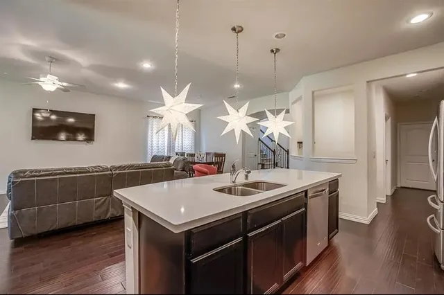 a kitchen with a sink and a refrigerator