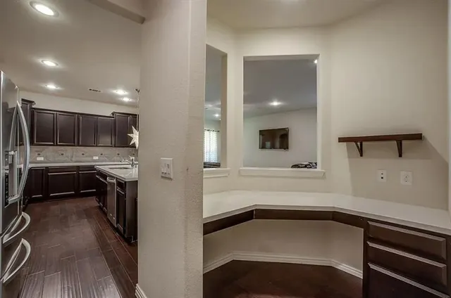 a view of a kitchen cabinets a sink and dishwasher in a kitchen