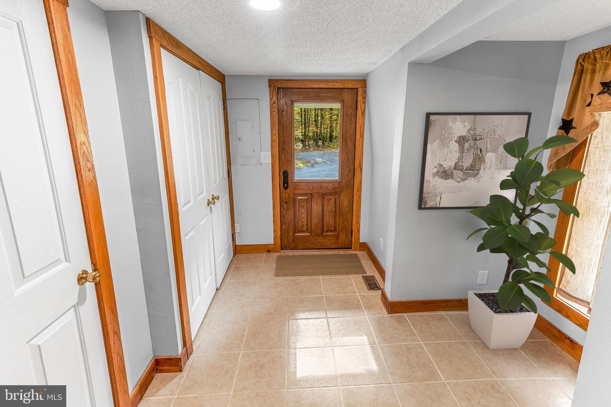 2160 Black Bear Road Needmore, PA 17238 - Photo 12 of 78 side porch entry/ laundry closet virtually staged