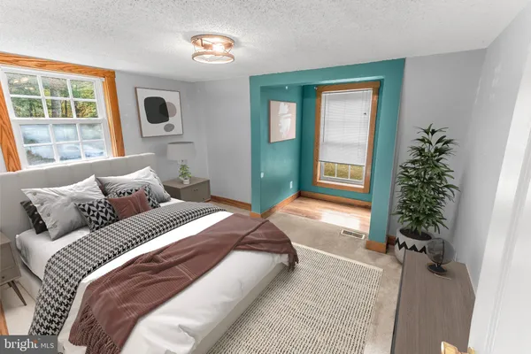 a view of a entryway with wooden floor and furniture