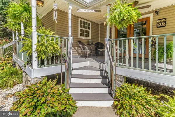 a view of a house with a yard and garage