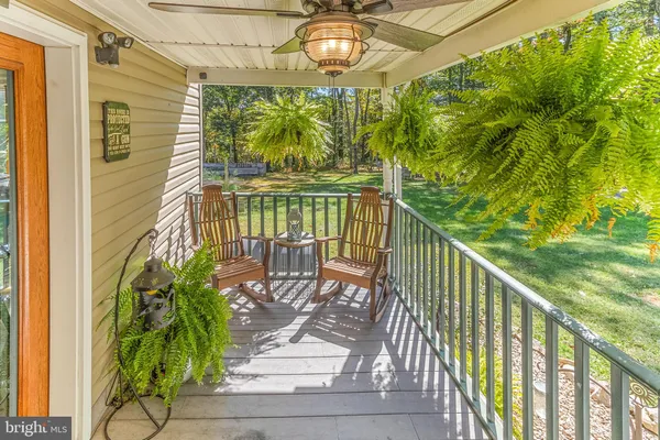 a view of a chairs and table in the patio