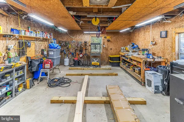 a view of an entryway with wooden floor and windows