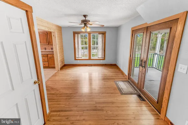 a kitchen with stainless steel appliances granite countertop a sink and a refrigerator