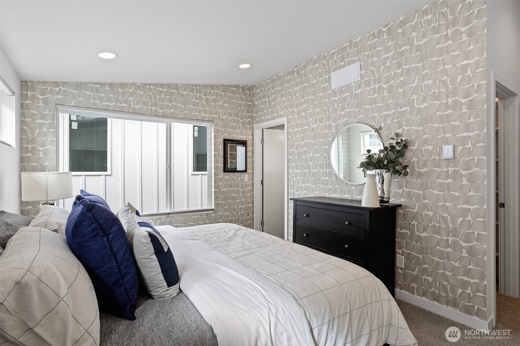 2527 29th Avenue South, Unit C Seattle, WA 98144 - Photo 16 of 20 a bedroom with a bed and a dresser
