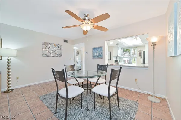 a dining room with furniture and window