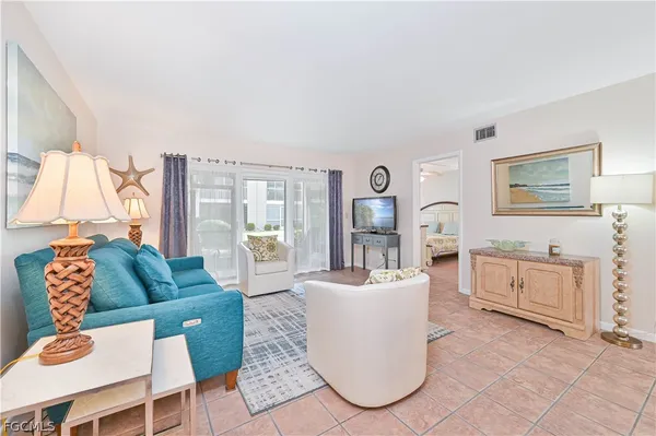 a living room with furniture and a couch