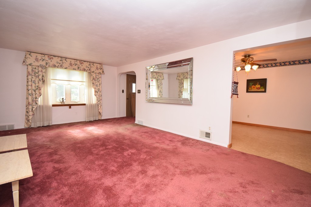 167 Woodcrest Road Springfield, MA 01129 - Photo 13 of 22 a view of an empty room with a window and wooden floor