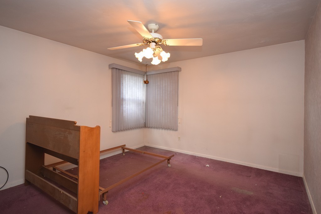 167 Woodcrest Road Springfield, MA 01129 - Photo 7 of 22 wooden floor in an empty room with a window
